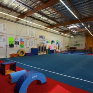 View of the Pacific West Gymnastics facility, showcasing the tumbling mat.