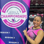 Aiyana and the Regional Championships banner, 2023.