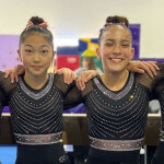 Two gymnasts side by side.