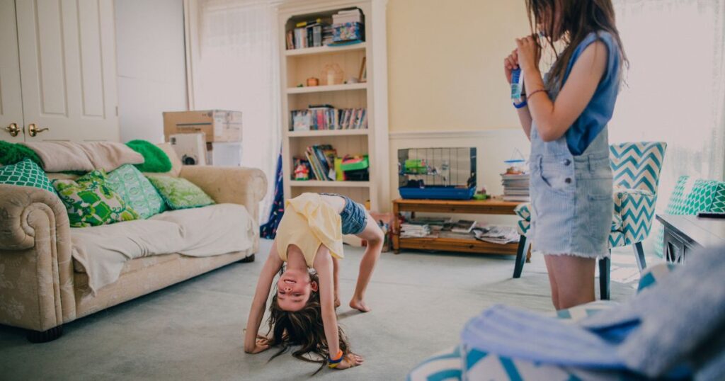 Gymnast practicing a bridge at home